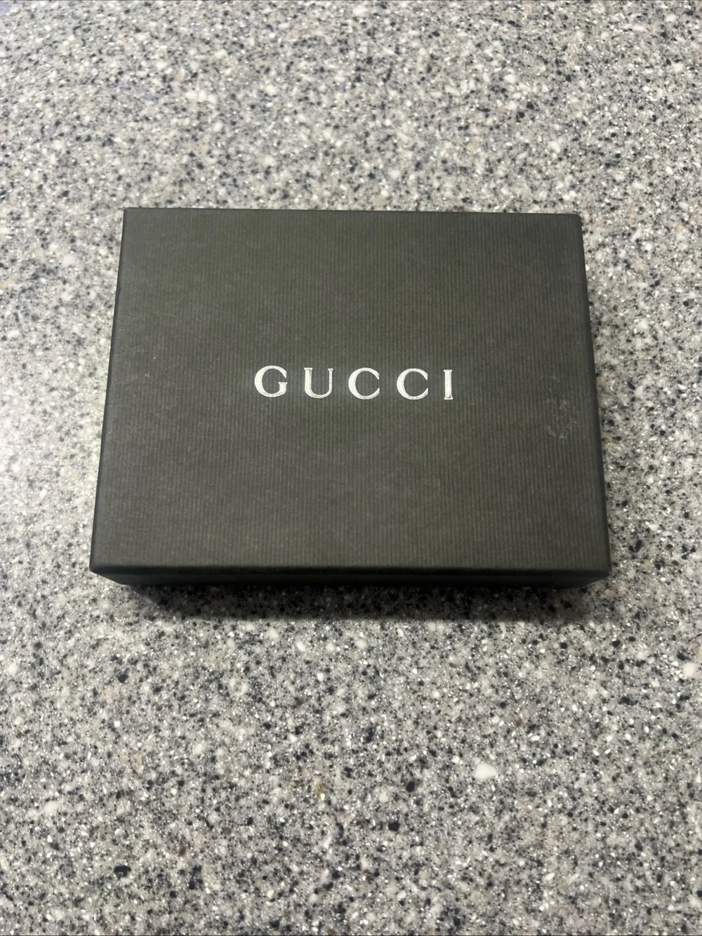 Gucci Black Leather Bifold Card Holder with Silver G-Clip Accent